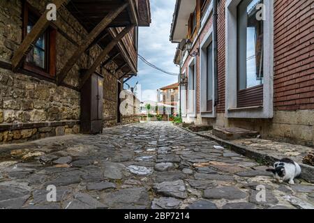 NESSEBAR, BULGARIA - JUNE 22, 2019: Beautiful and narrow street of the ancient seaside town. Deserted streets in the early morning. Stock Photo
