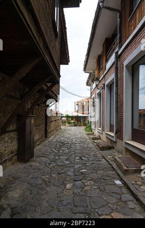 NESSEBAR, BULGARIA - JUNE 22, 2019: Beautiful and narrow street of the ancient seaside town. Deserted streets in the early morning. Stock Photo