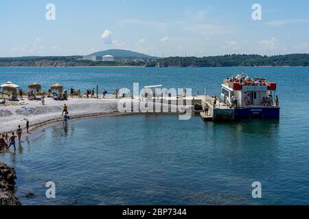 ST. ANASTASIA ISLAND, BULGARIA - JUNE 23, 2019: Pleasure boat at the pier. The Burgas Bay of the Black Sea. Stock Photo
