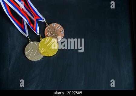 Gold, silver and bronze medal. Medal set on black background, sport photo, black edit space Stock Photo