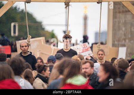 Pupils demonstrate with protest posters during the Fridays for Future climate strike at the Brandenburg Gate -Pariser Platz- in Berlin. Stock Photo