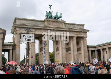 Pupils demonstrate with protest posters during the Fridays for Future climate strike at the Brandenburg Gate -Pariser Platz- in Berlin. Stock Photo