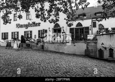 MEISSEN, GERMANY - OCTOBER 12, 2019: Historic buildings in the square in front of Albrechtsburg Castle and Meissen Cathedral. Black and white. Stock Photo