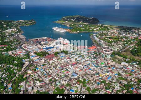 Aerial view from helicopter of Castries, the main port and capital of St Lucia island in the Caribbean, West Indies. The small airport is at top right Stock Photo