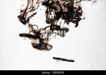 a beautiful image of a black liquid mixing in water, abstract pattern Stock Photo