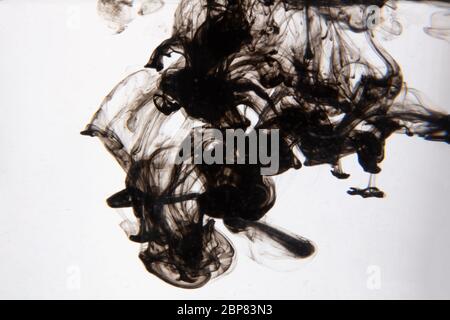 a beautiful image of a black liquid mixing in water, abstract pattern Stock Photo