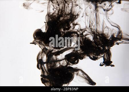 a beautiful image of a black liquid mixing in water, abstract pattern Stock Photo