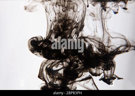 a beautiful image of a black liquid mixing in water, abstract pattern Stock Photo