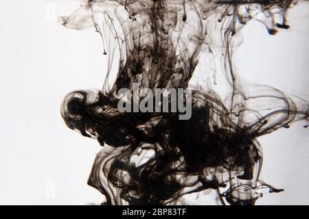 a beautiful image of a black liquid mixing in water, abstract pattern Stock Photo