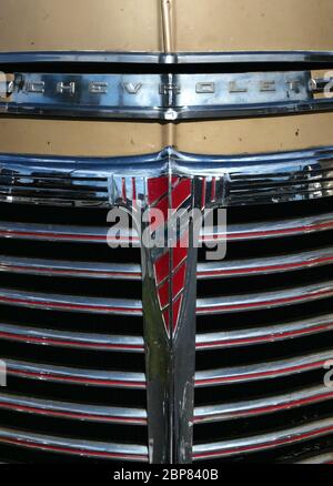 1950s Chevrolet Coupe vintage American car. close up of the grill and emblem Stock Photo