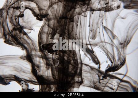 a beautiful image of a black liquid mixing in water, abstract pattern Stock Photo