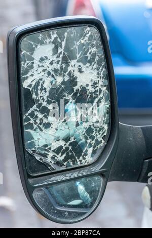 a close up view of a trucks side mirror that has been smashed Stock Photo