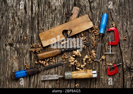 Old carpenter tools on rustic wood table top view. Stock Photo