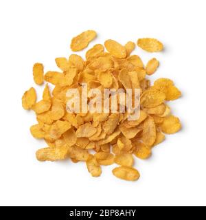 Heap of traditional cornflakes close up isolated on white background Stock Photo