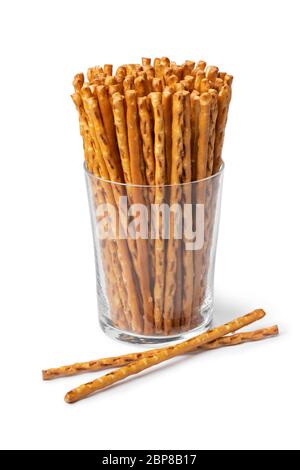 Glass with crunchy salted pretzel sticks isolated on white background Stock Photo