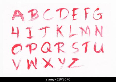 Letters A-Z with red watercolor on white paper background. Handwritten alphabet. Stock Photo