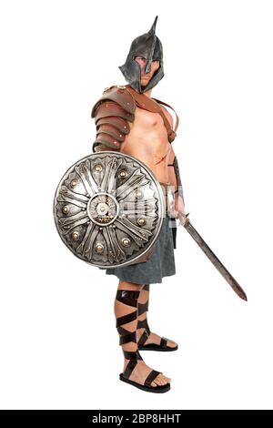 Gladiator posing isolated in a dark background Stock Photo - Alamy