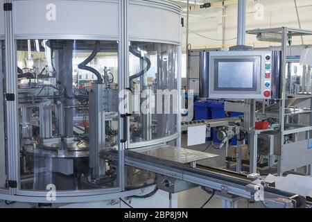 General view of the automatic production line with a control panel. All potential trademarks are removed. Stock Photo