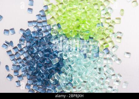 three different polymer plastic granulates on white background Stock Photo