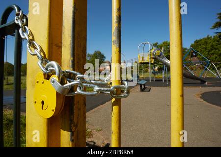 Close up of a padlocked gate at children's playground in Bexley, London, UK. The playground still closed for Coronavirus lockdown as of May 18th 2020. Stock Photo