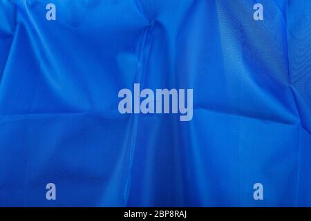 background of wrinkled blue silk fabric Stock Photo