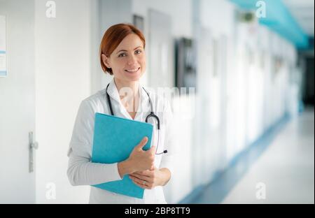 Portrait of woman doctor standing in hospital. Copy space. Stock Photo