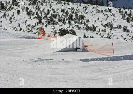 Snowboard Ramp for Big Jumps at Mountain Stock Photo