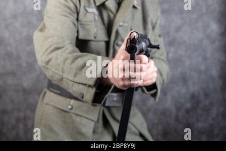 a world war two German soldier with machine gun MP 40, close-up Stock Photo