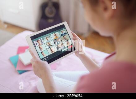 Unrecognizable young woman with tablet, online business call concept. Stock Photo