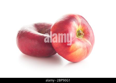 Ripe flat nectarines isolated on white background. Stock Photo