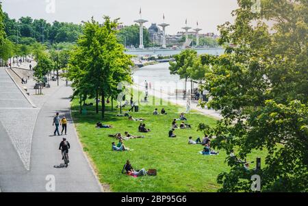 Lyon France, 16 May 2020 : People doing outdoor activities on Rhone river bank  on the first weekend of the unlockdown in Lyon France Stock Photo