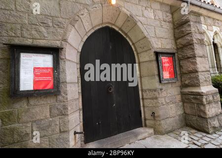 entrance to the Cloisters Museum in Fort Tryon Park in Washington Heights with signs saying it is closed due to the coronvirus or covid-19 pandemic Stock Photo