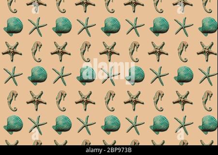 Collection of different seashells, pattern of turquoise shells on sand color background, summer vacation concept. Stock Photo