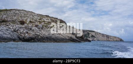 Coastline cliffs near Blue Caves as seen from a tourist boat, Zante Island, Greece Stock Photo