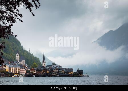 Hallstatt view in a foggy day and clouds between the mountains Stock Photo