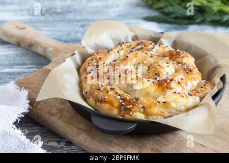 Vertuta, traditional Romanian, Moldavian or Balkan baking pie. Spiral filo pastry pie. Stock Photo