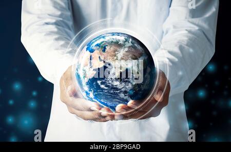 Businessman hand holding multinational hologram globe concept for world map responsibility, cloud internet network connection, international tech info Stock Photo