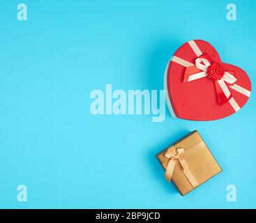 two cardboard holiday boxes on a blue background, top view, copy space Stock Photo