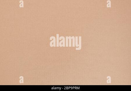Background Of Plain Light Brown Large Sheet Of Cardboard Texture. Stock Photo