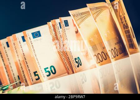 Different Denominations Of Euro Foreign Currency Banknotes Organized In Neat Row. Stock Photo