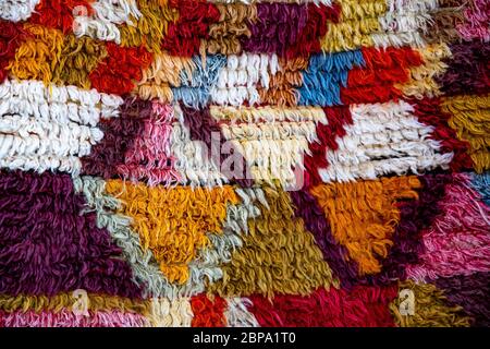Colorful fluffy carpet with rhombus pattern. Turkish ornamental carpet background. Woven texture. Ethnic pattern rug. Traditional Asian ornaments. Tur Stock Photo