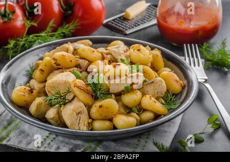Fried gnocchi chicken curry, food photography, delish food with herbs Stock Photo
