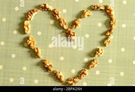 Peeled California Walnut Kernel On Blue Background With White Dots Stock Photo