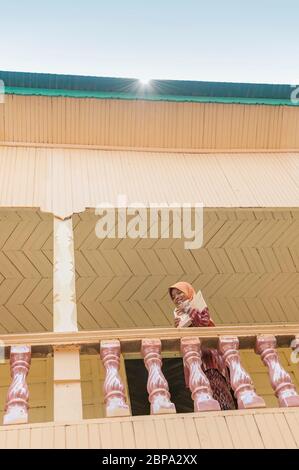 Young Muslim girl in a rural Cham village school. Central Cambodia, Southeast Asia Stock Photo