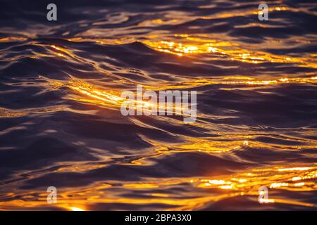 Sea sunset.  Ocean Ripples waves as water texture background. Stock Photo