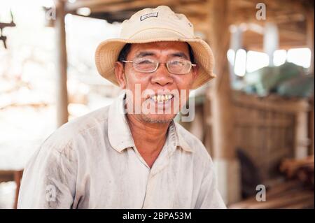 A portrait of a man in a rural Cham village. Central Cambodia, Southeast Asia Stock Photo