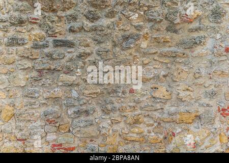 Old stone wall as a background or pattern Stock Photo