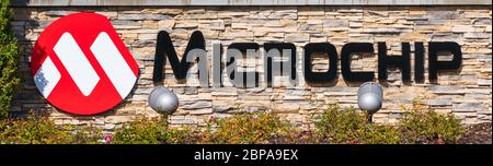 Microchip sign and logo. Microchip Technology Inc. manufactures microcontrollers, mixed-signal, analog and Flash-IP integrated circuits - San Jose, Ca Stock Photo