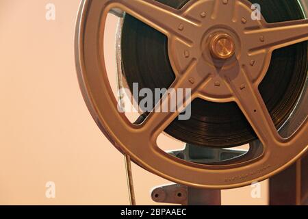 an old-fashioned film reel mounted for viewing on camera Stock Photo