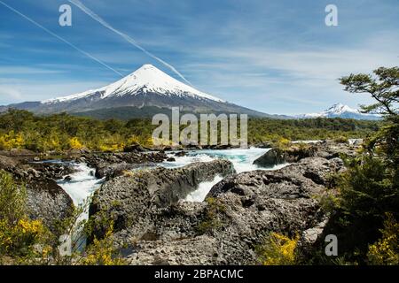 The waterfalls and rapids of Petrohue, with Volcan Osorno, in the Vicente Perez Rosales National Park of Los Lagos Region, near Puerto Varas, Chile Stock Photo